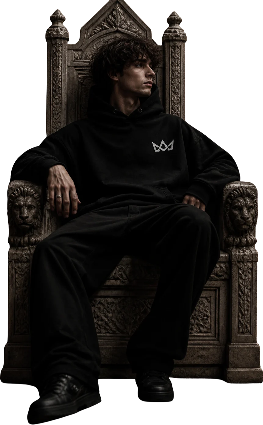 Model in the Emblem hoodie on a stone throne